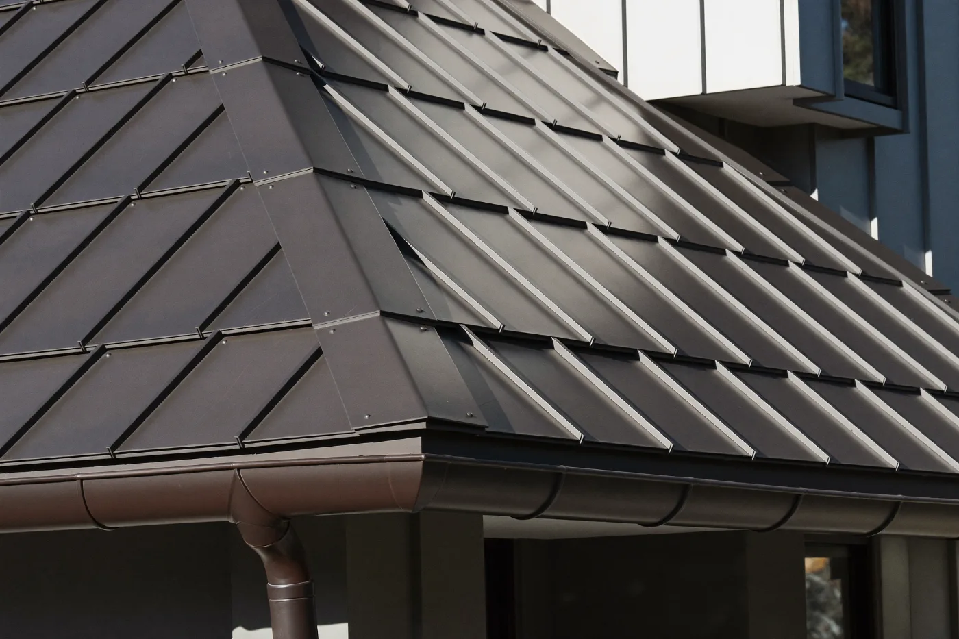 Close detail of cladding panel joints with hidden fixings and shadow gaps