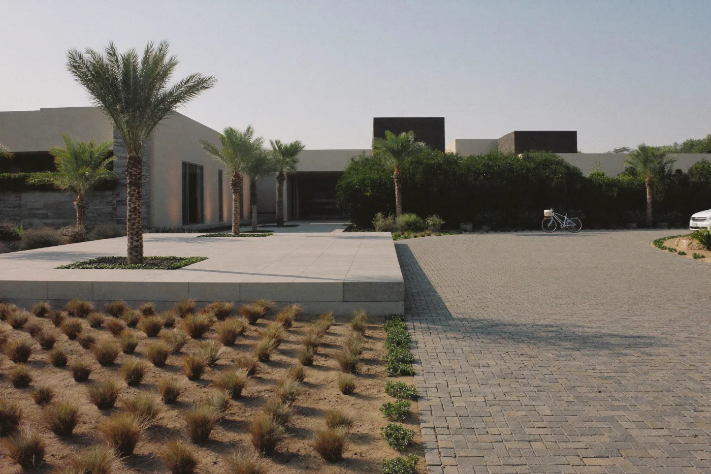 Completed interlock paved driveway with a neat border course