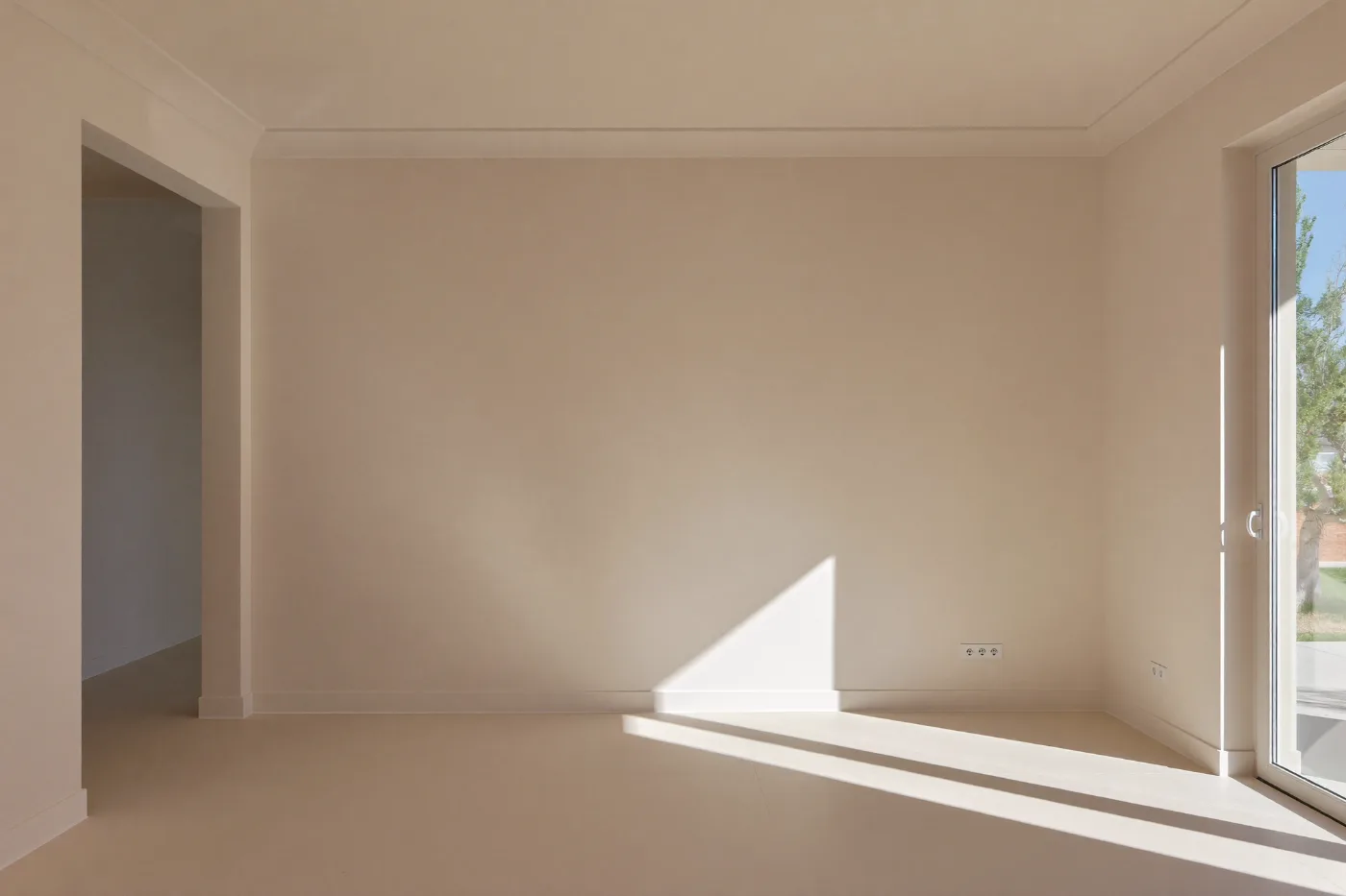 Freshly painted villa interior with smooth walls in warm neutral tones