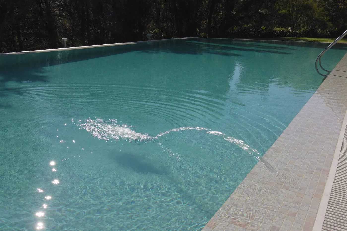 Villa swimming pool with clear balanced water and a clean waterline