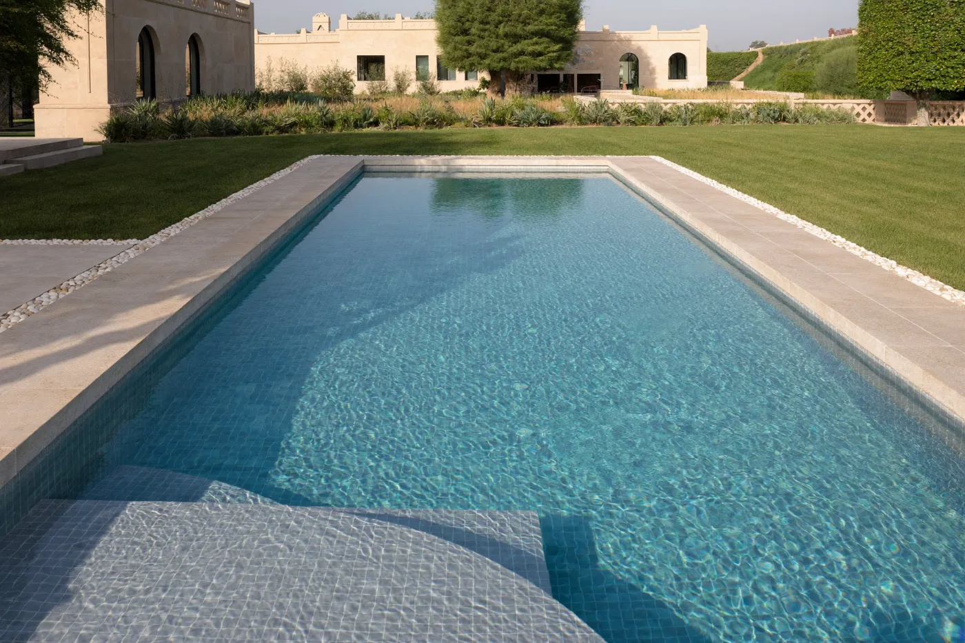 Restored swimming pool refilled with clear water after repair